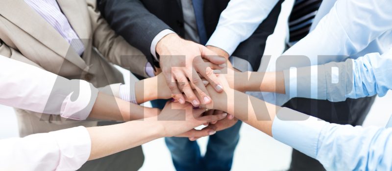 Business people joining hands in circle Business people joining hands in circle
